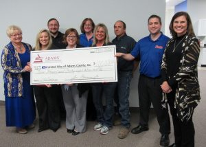 Pictured from left: Jenny Hayden, United Way of Adams County Board President; Darlene Scheuermann, Rob Miller, Kathy Bruns, Shellie Mittermeyer, Renee Hull, Jeff Weinberg, David Hess, Adams employees; and Emily Robbearts, United Way Executive Director.